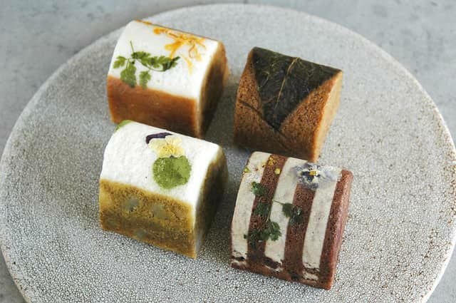 鹿児島ふくれ菓子4種セット。黒糖色のサンボ・桜島小みかん味のコミカン・緑茶色キリシマ・ココア色ペッシェミニョンの詰め合わせ