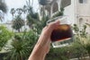 鹿児島の景色とFUKU+REオリジナルコーヒーバッグのアイスコーヒー